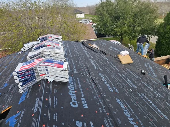Shingles and roof underlayment during a DeMilan roof replacement