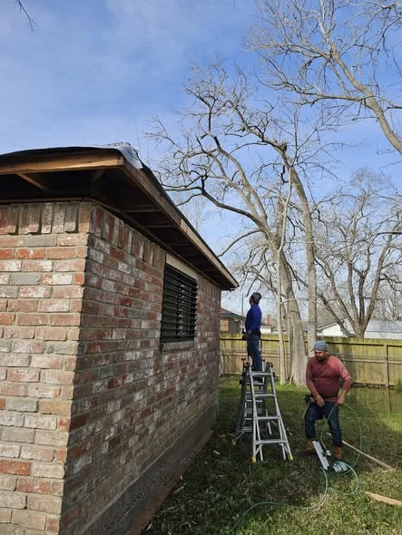 DeMilan crew working on a home’s exterior roofline